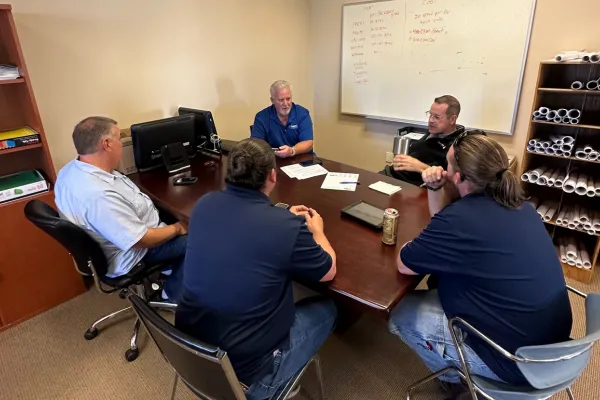 Technicians and Managers Training Around Table