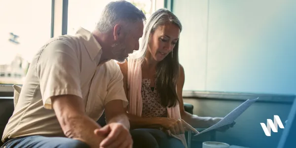 Couple discussing options at table