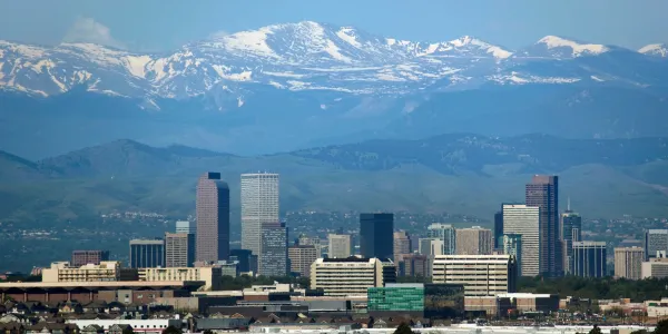Colorado city with mountains in the background
